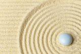 White drop on surface of yellow sand - abstract background