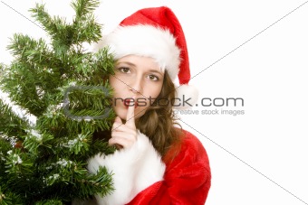 Young attractive Santa Claus Woman beside Christmas fir tree put