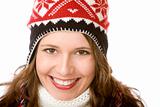 Portrait of young attractive smiling woman with cap and scarf in