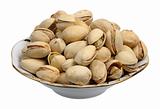 Pistachios on a plate, isolated