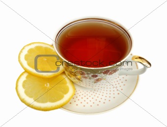 A cup of tea and slices of lemon