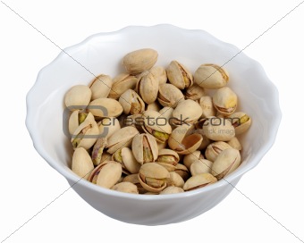Pistachios on a plate, isolated