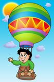 Boy in balloon on sky