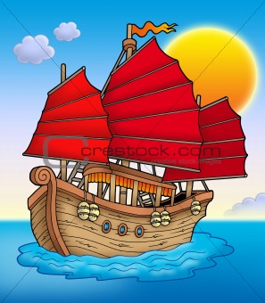 Traditional Chinese ship with sunset