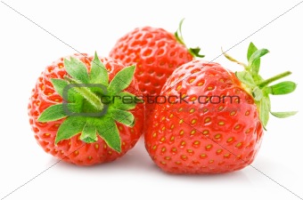 fresh strawberry fruits with green leaves