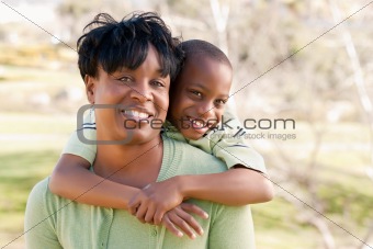 Happy African American Woman and Child Having Fun in the Park.