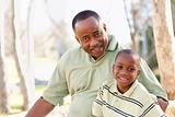 Attractive African American Man and Child Having Fun in the Park.