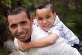 Hispanic Father and Son Having Fun Together in the Park