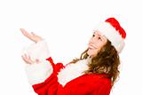 Young happy Santa Claus woman catching falling Christmas gifts