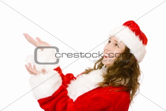 Young happy Santa Claus woman catching falling Christmas gifts