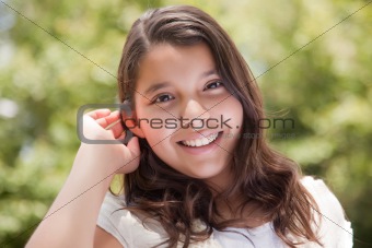 Cute Happy Hispanic Girl Portait in the Park.