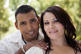 Attractive Hispanic Couple Portrait in the Park.
