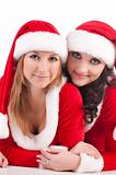 Two girl friends in christmass costumes.