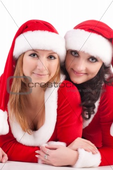 Two girl friends in christmass costumes.