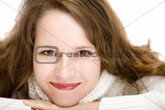 Portrait of young attractive woman with chin on hands smiling ha