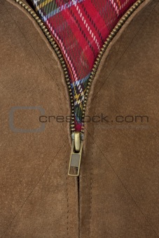 unzipped brass zipper of leather jacket