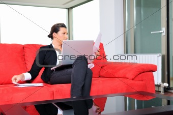 young business woman working on laptop at home