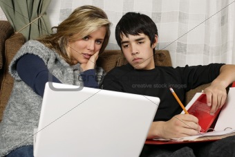 Teenagers doing homework with laptop