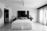 Hotel resort bedroom suite in black and white