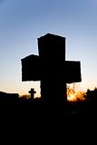Silhouettes of Two Crosses at Sunset