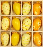 Yellow Easter eggs in a box