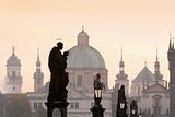 view of spires of the old town from charles bridge at dawn