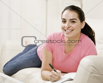 Young Woman Writing in Journal