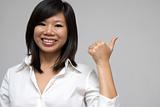 asian women smiling and giving thumbs up