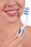 Close-up of a yougn woman smile with toothbrush