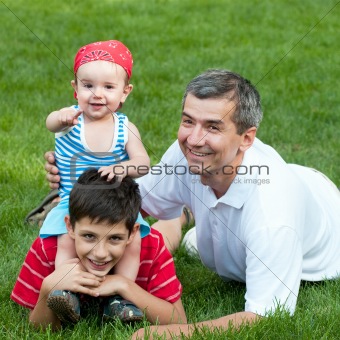 Father and his sons  in the park