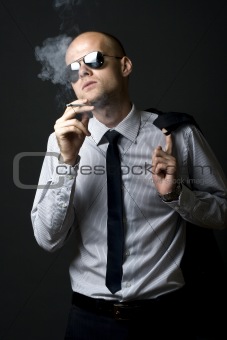 Young businessman smoking