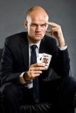businessman holding a poker hand