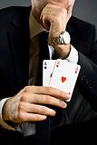 businessman holding two aces
