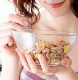 Young people eating milk with cereals