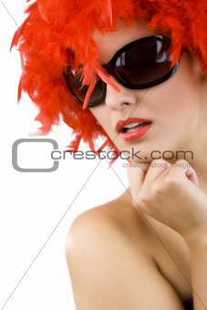 sexy woman with red feather wig and sunglasses