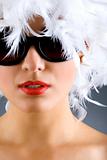 woman with white feather wig and sunglasses