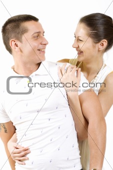 Young couple cuddling happily in love
