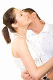 Man kisses young woman