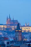  prague - old town city hall tower and hradcany castle at dusk