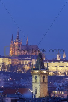  prague - old town city hall tower and hradcany castle at dusk