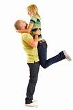 young man holding his girlfriend in the air