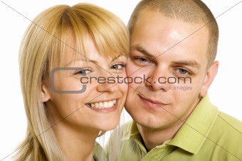Happy young man and woman standing together