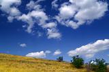 Hillside and sky with clouds