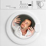 funny portrait of man inside washing machine