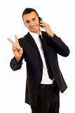 businessman on the phone making his victory sign