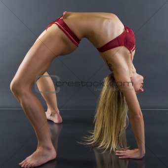 sporty girl in upward bow pose