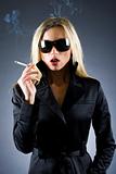  blond woman holding a cigarette