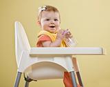 Baby Girl in High Chair