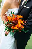 Colorful Bouquet Held by a Bride and Groom