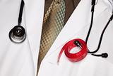 Doctor with Stethoscope and Red Measuring Tape.